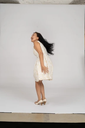 Woman in a white dress standing