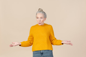 Elegant older woman looking surprised