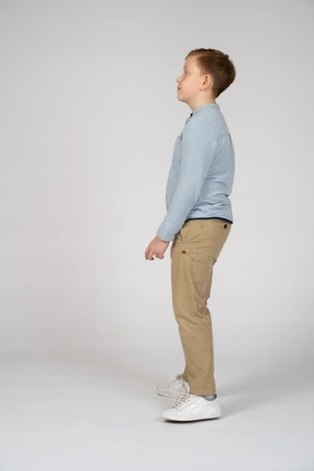 Side view of a cute boy looking up