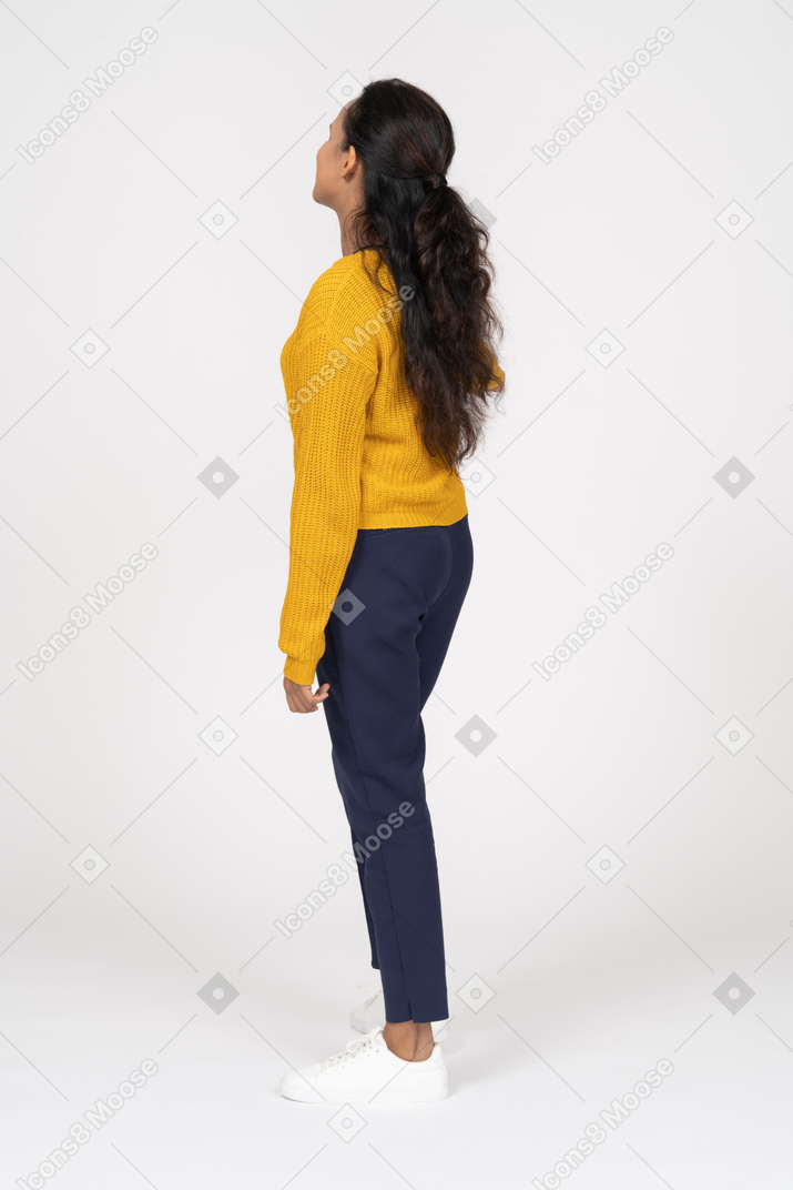 Side view of a girl in casual clothes looking aside