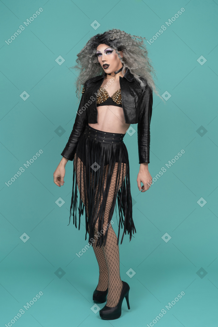 Drag queen posing with arms at sides