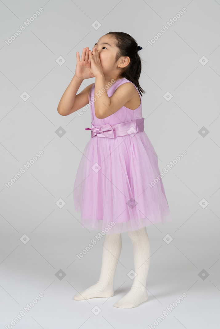 Little girl in pink dress calling out