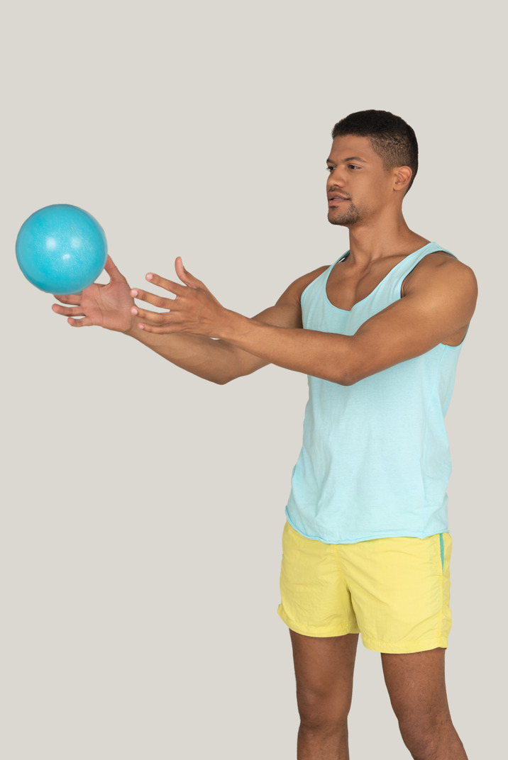 Man holding a globe in front of his face