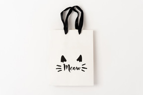 Cute little paper gift bag with black hands