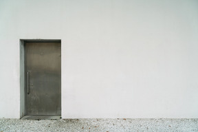 White wall with steel door