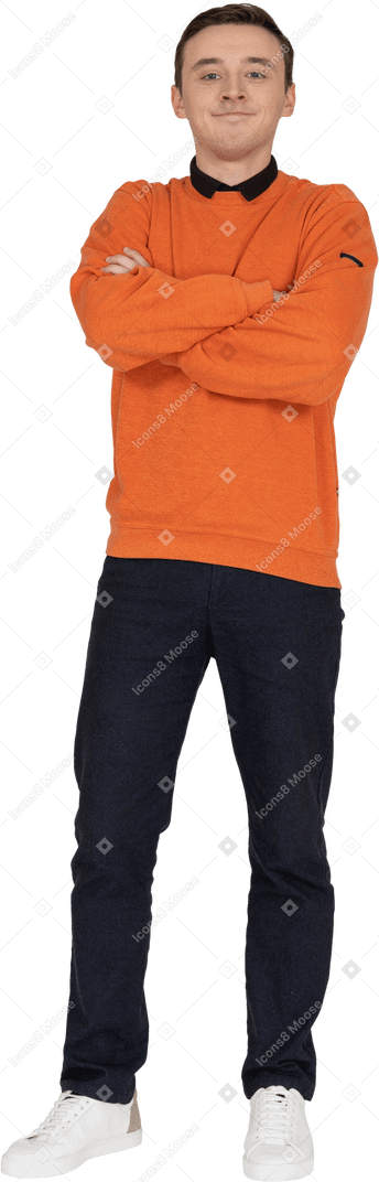 Young man in orange sweatshirt standing