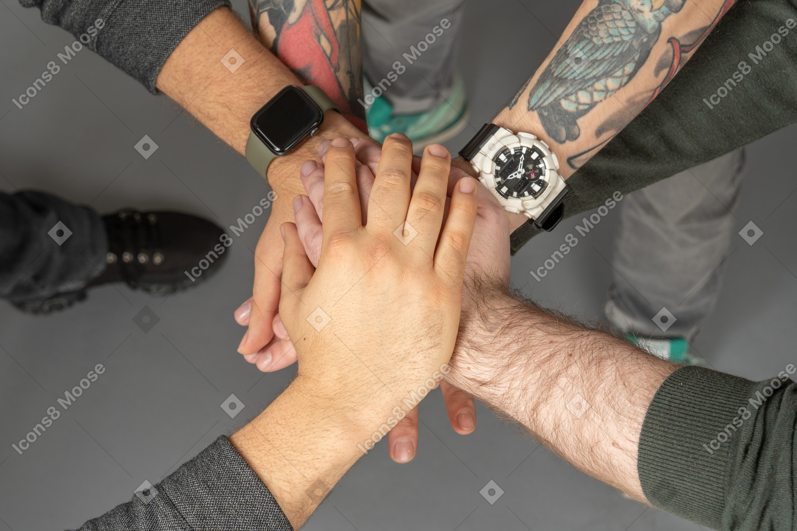 Hands with watches joint together