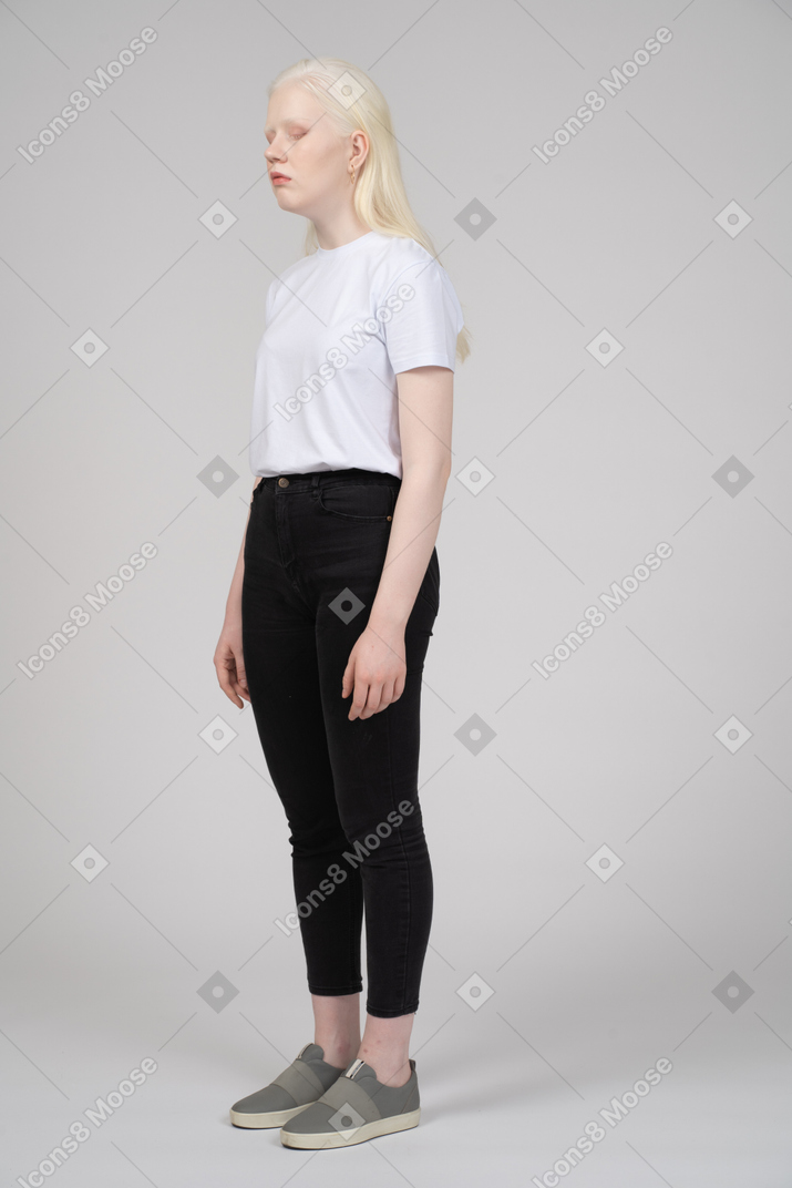 Three-quarter view of a teenage girl in casual clothes