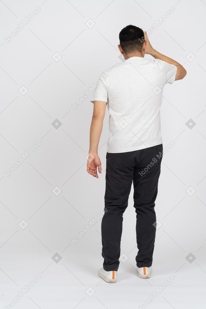 Back view of a man looking through imaginary binocular
