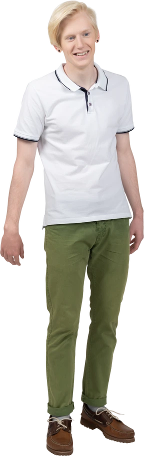 Happy young man standing still