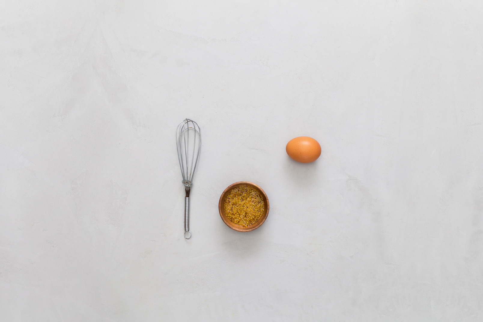 Wire whisk, egg and spices