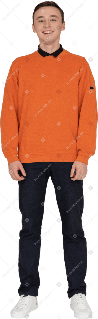 Young man in orange sweatshirt standing