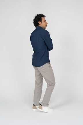 Man in casual clothes posing in profile