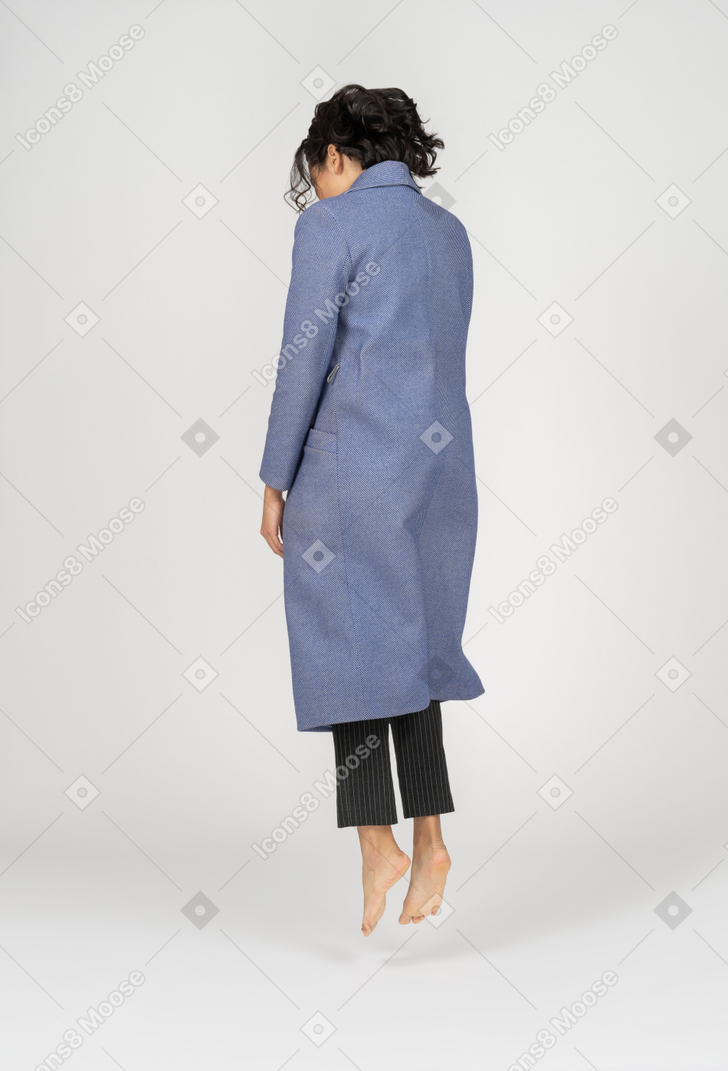 Back view of woman levitating