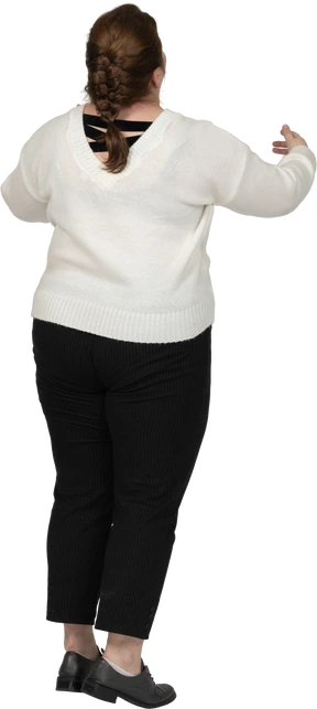 Rear view of a plump woman in casual clothes