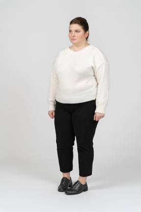 Sad plump woman in white sweater