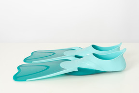 Blue swimming fins on a white background