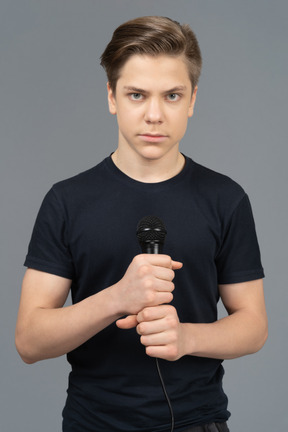 Young man holding microphone