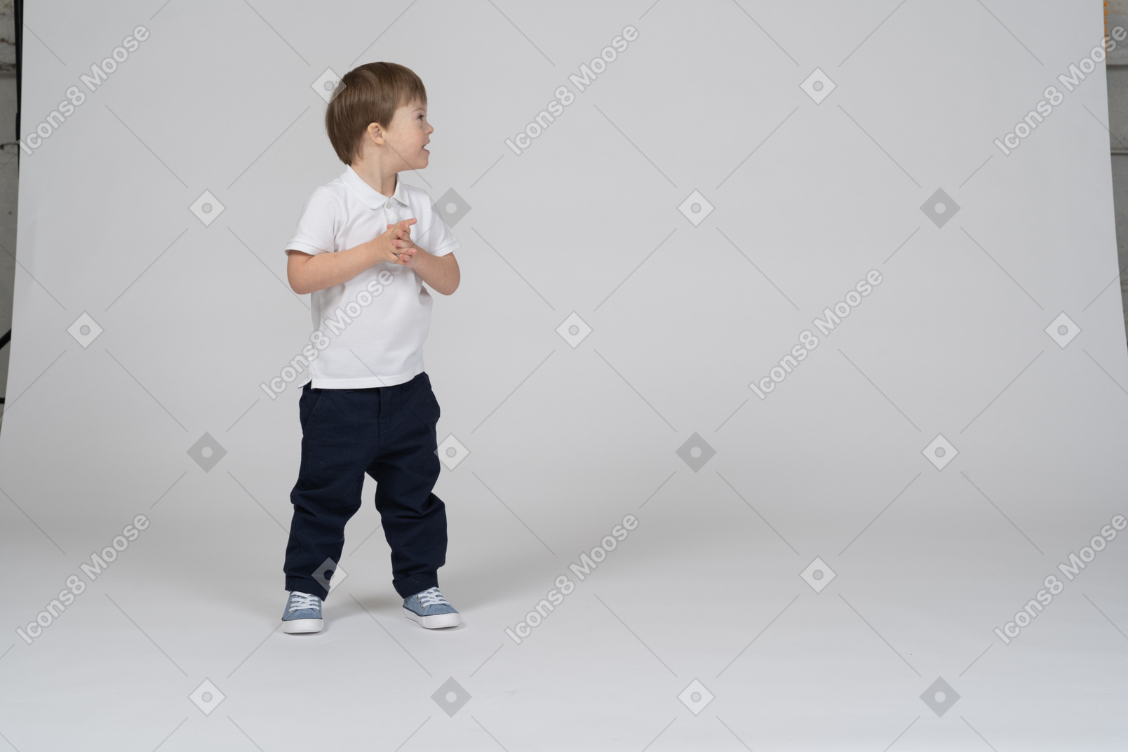 A boy standing in front of an open door