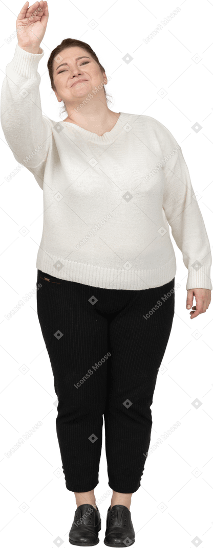 Front view of a plus size woman in casual clothes greeting someone