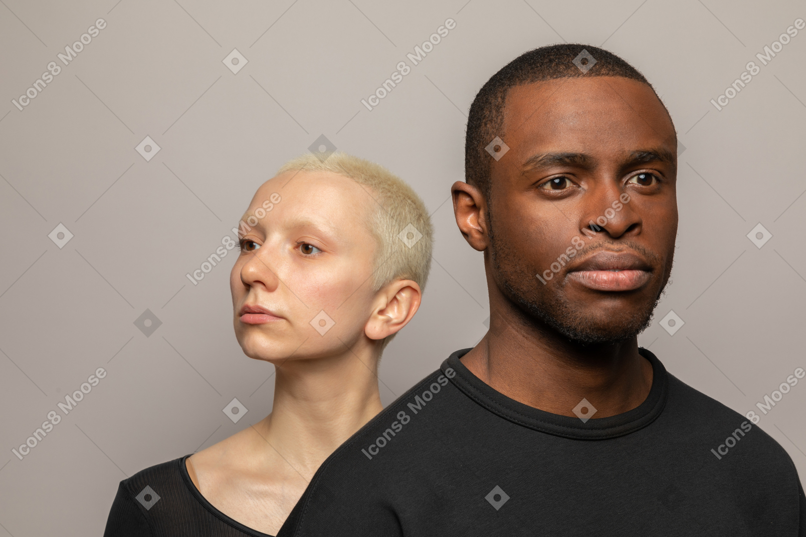 International couple looking in different directions