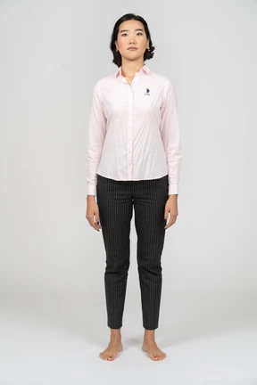 Front view of a woman in work clothes standing