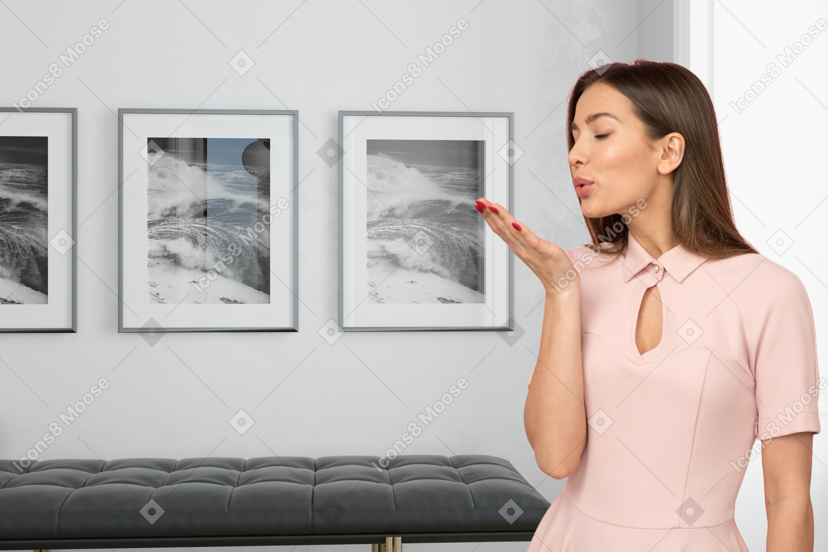 A woman in a pink dress blowing a kiss