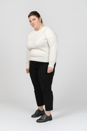 Plump woman in casul clothes standing