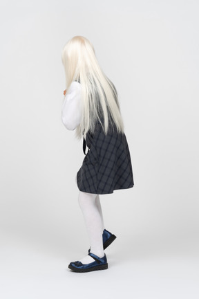 Back view of a girl in school uniform