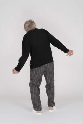 Back view of a senior man falling back