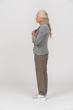 Side view of an old lady in suit