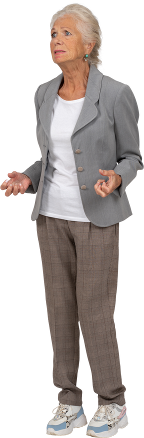 Front view of an old lady in suit gesturing