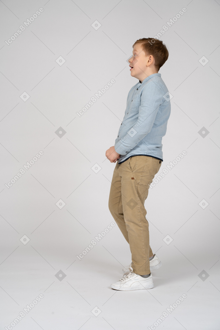 Side view of an impressed boy