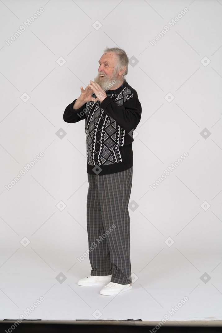 Old man showing love sign and smiling