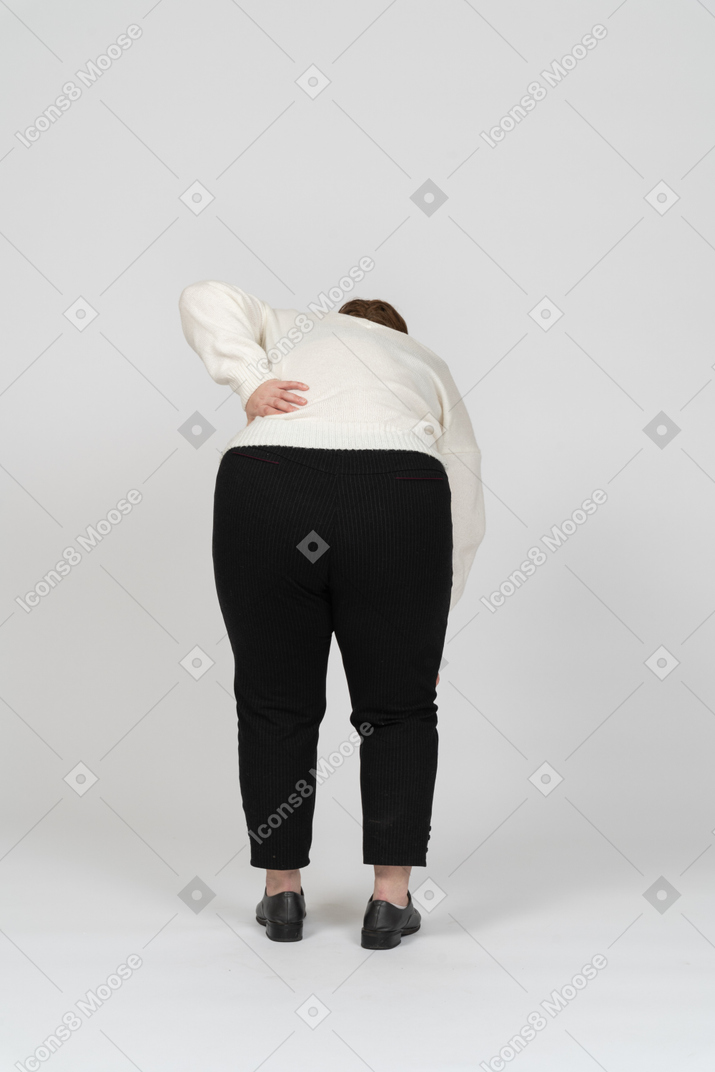 Plus size woman suffering from pain in lower back