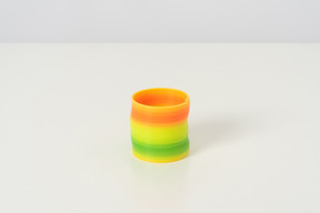 A colorful slinky toy in its default state