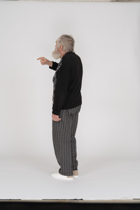 Side view of old man showing index finger