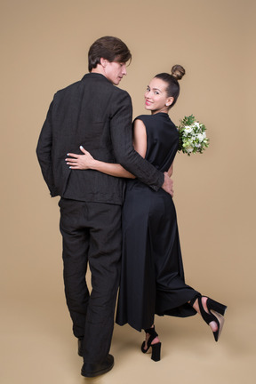 Back view of a young couple on their engagement day