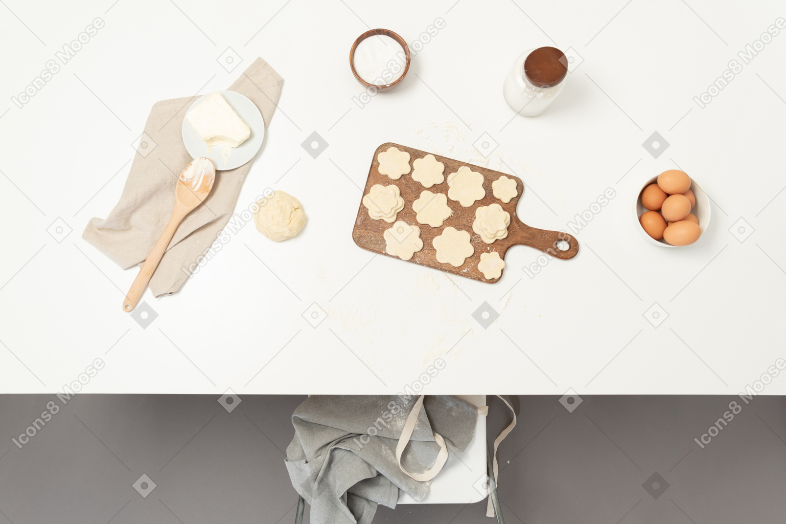 A table with cookies prepared for baking
