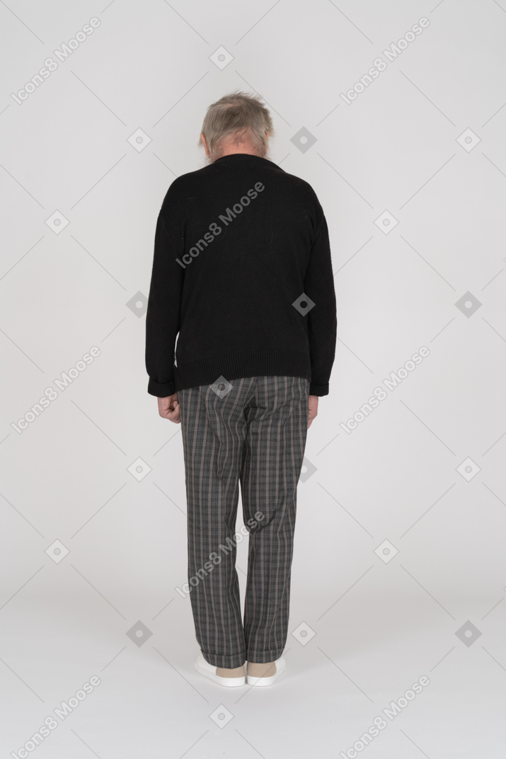 Back view of a man in black sweatshirt standing
