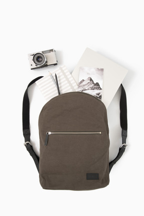 City backpack with laptop and photo camera