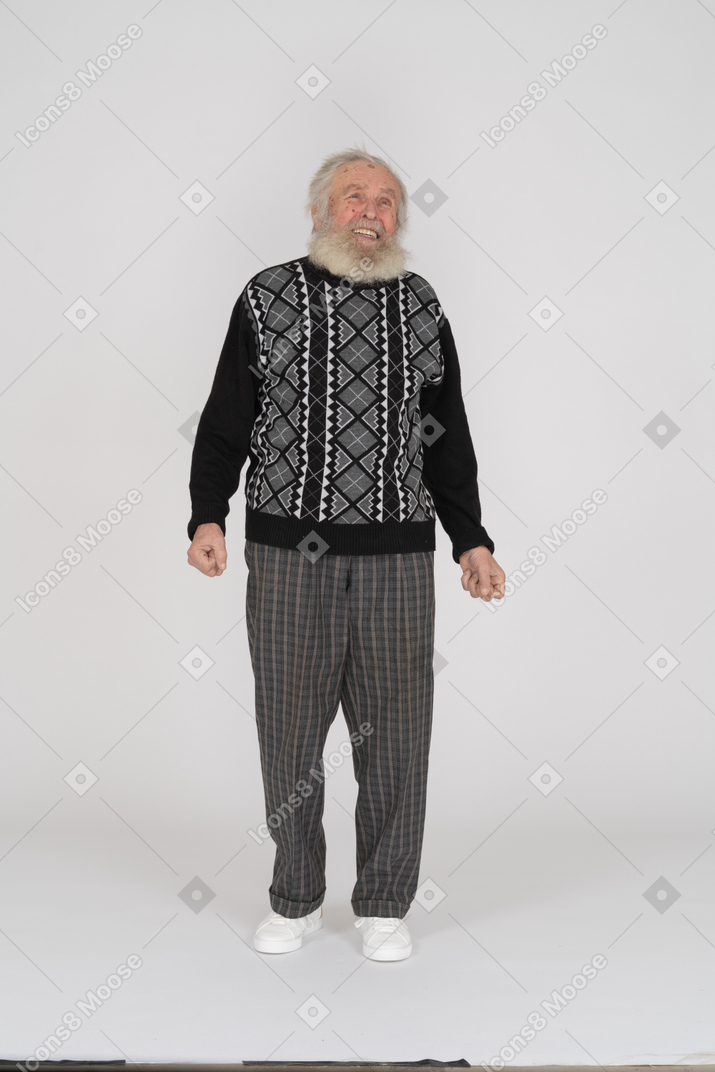 Grinning old man with spread arms