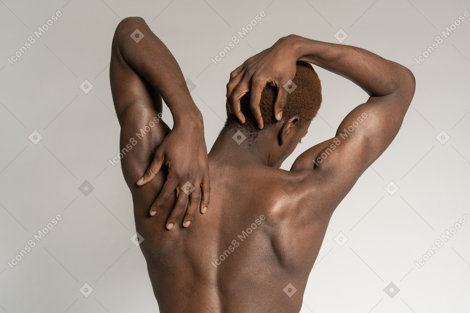 Man stretching and touching back and head