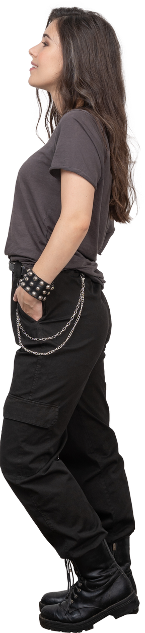 Side view of a contented female rocker putting hands in pockets
