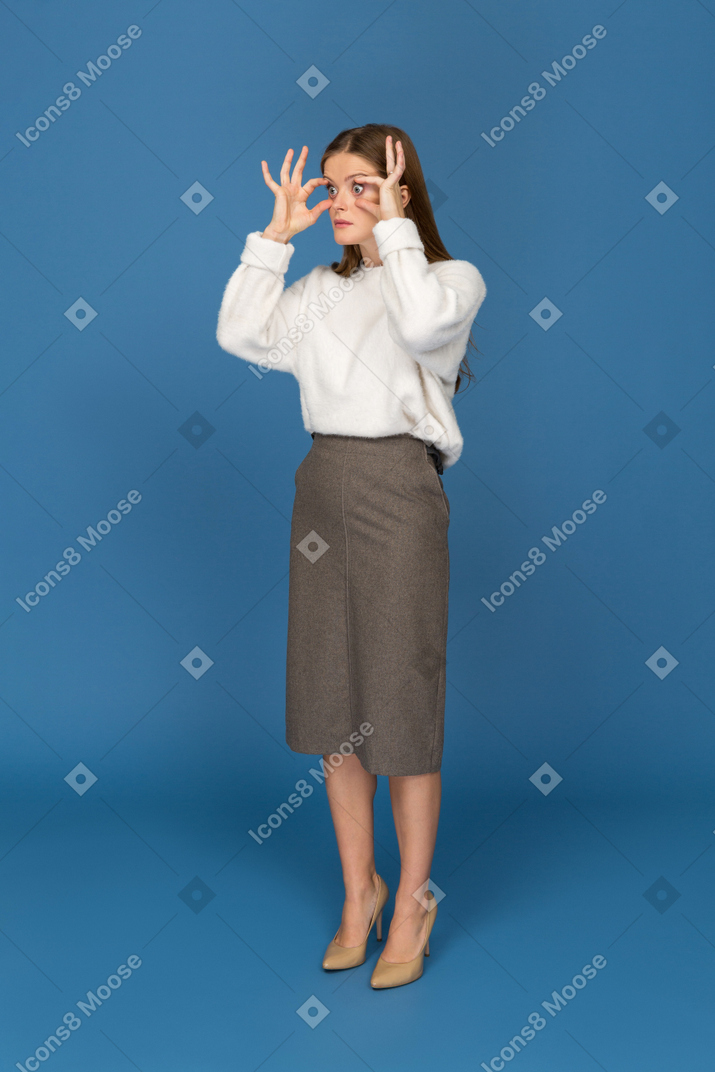 Young businesswoman making astonished grimace