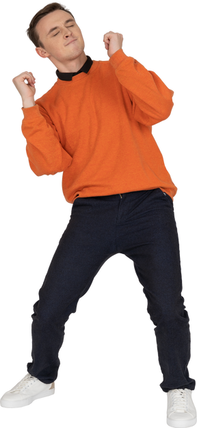 Young man in orange sweatshirt dancing