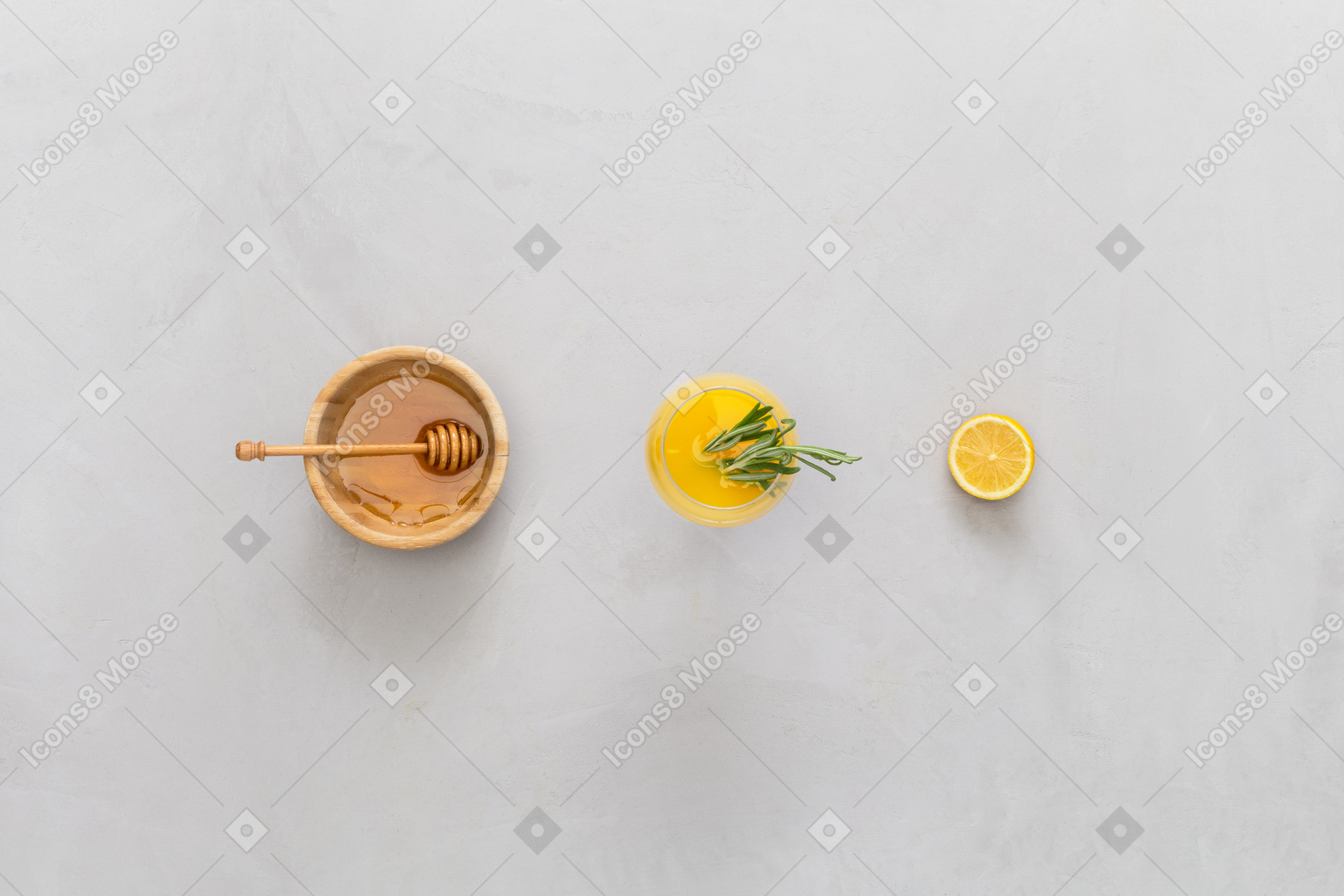 Bowl of honey, lemon juice and lemon half