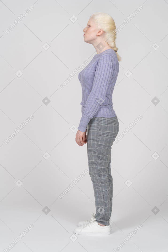 Side view of annoyed young woman