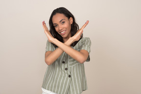 Young woman making stop gesture