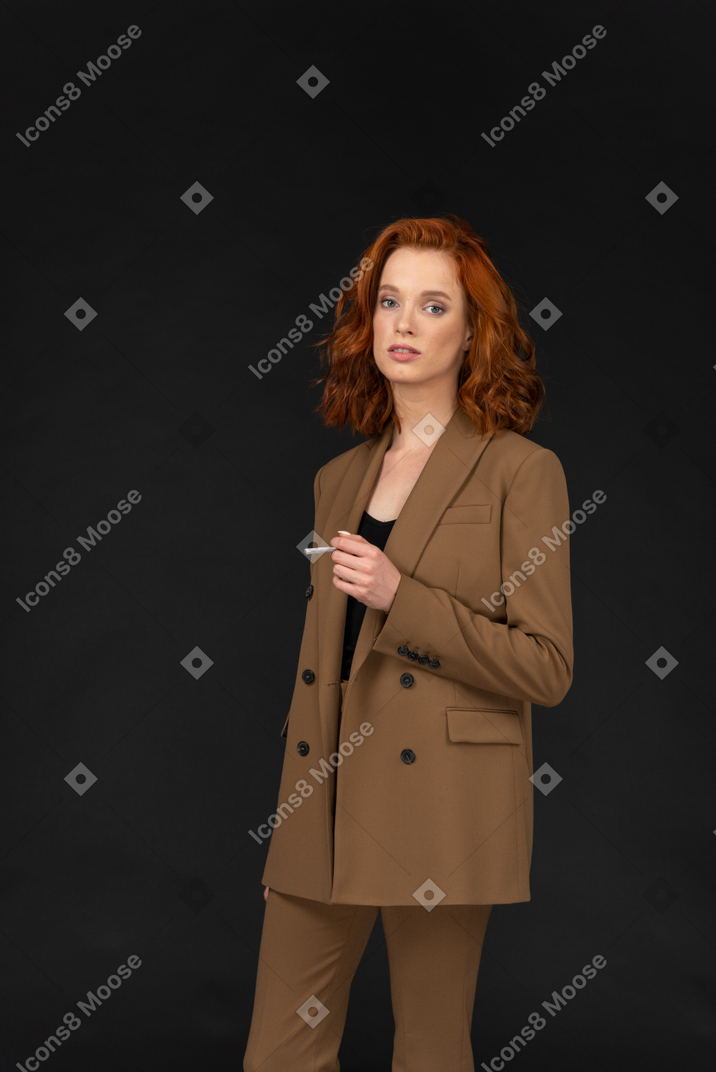 Attractive businesswoman holding a cigarette